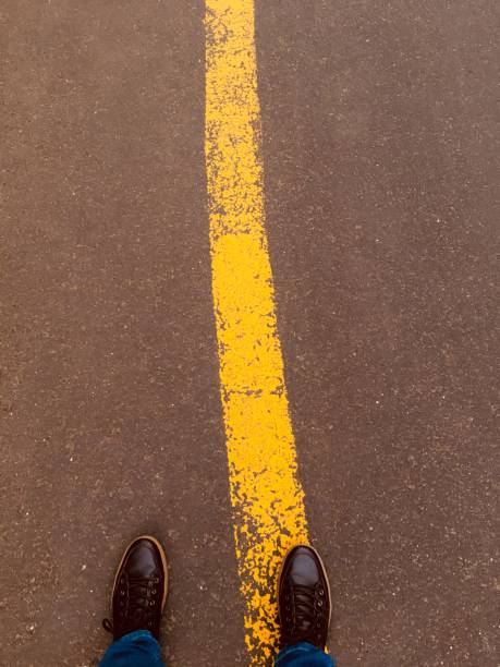 istock foot on the road! 1172502347