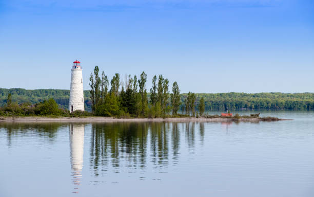 istock lighthouse reflecting in the water 1172506222