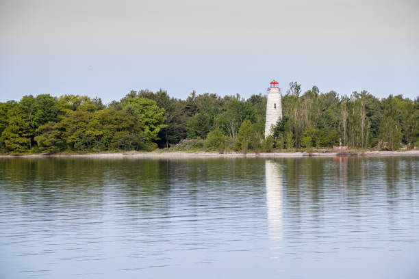 istock Lighthouse on Christian Island reflecting in Lake Huron 1172506457