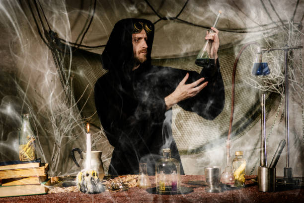 istock The medieval alchemist make magic ritual at the table in his smoke laboratory. 1172506570