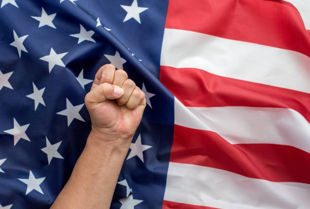 istock Clenched Fist With American Flag Background 1172507988