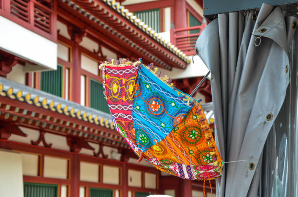 istock Singapore - FEB 28, 2019: Umbrella hanging on the shed. 1172510412