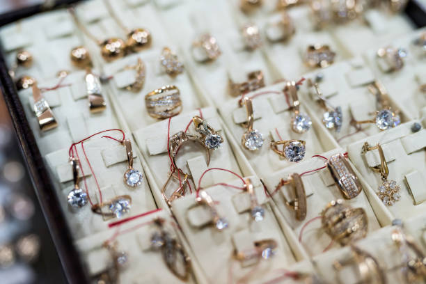 istock Selective focus on golden earrings with ring on showcase 1172514160