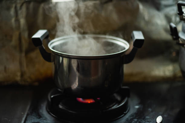istock steam over cooking pot in kitchen 1172515137