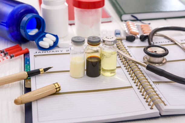 istock Ampoules and stethoscope on schedule on the table 1172515275