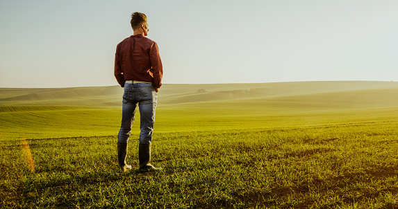 Man standing on green meadow, Moravian Slovakia,Czech Republic