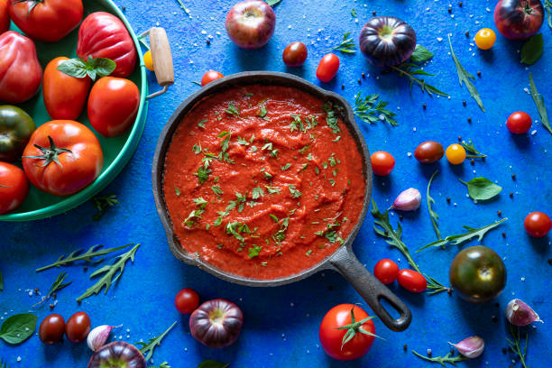 Fried tomato sauce with tomatoes on wood
