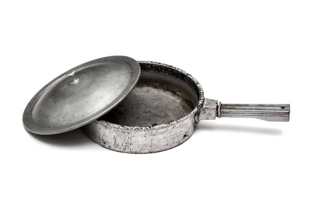 istock Old cast iron frying pan isolated on white 1172516783