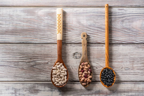 istock Dried beans legumes on wood spoon 1172517162