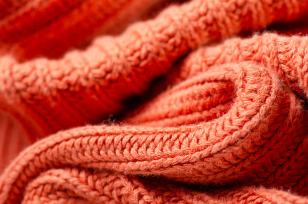 istock Orange warm knited material fabric sweater texture 1172517818