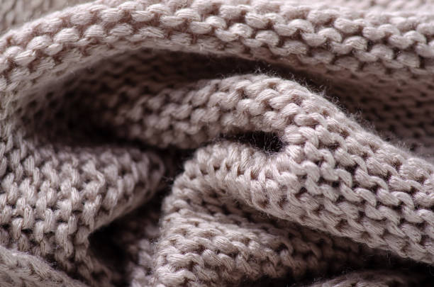 istock Beige warm knited material fabric sweater texture 1172517931
