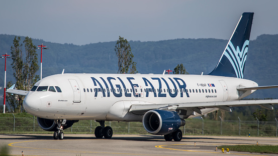 Mulhouse, France - August 24, 2019: An Airbus A320-214 from Aigle Azur prepares to take off from Basel-Mulhouse Airport. The aircraft with registration F-HBAP has been in service since April 2011 for the French airline.