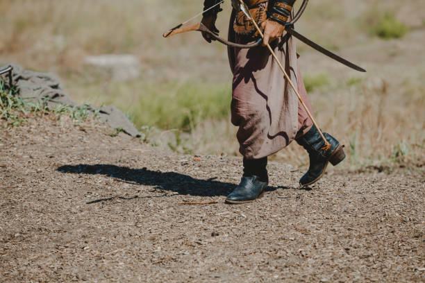 istock ancient warrior holds bow and arrow in his hands 1172520692