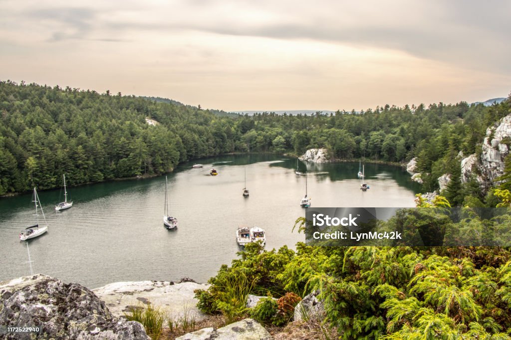 boats at anchor in Covered Portage, Killarney, Canada sailboats at anchor in protected anchorage in Killarney, Canada. Covered Portage is a favourite place to visit when doing the Great Loop by boat. Ontario - Canada Stock Photo