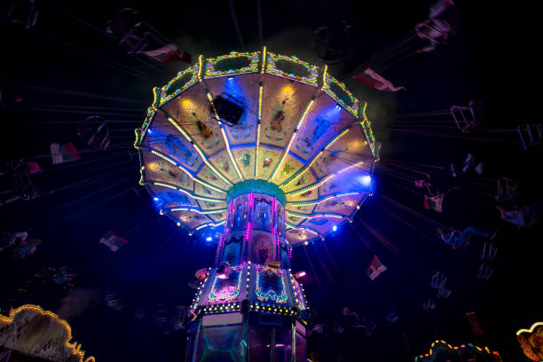 A swinging fair ride at dusk