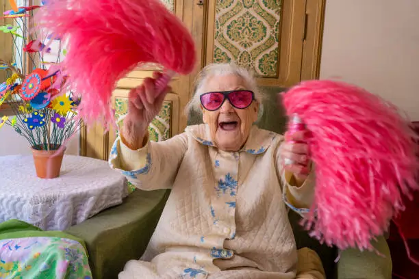 Photo of Cheerleader pom-pom elderly woman happy