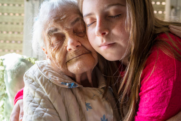 istock Grandmother and granddaughter hug affectionate 1172531030