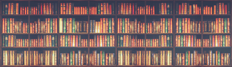 panorama blurred bookshelf Many old books in a book shop or library