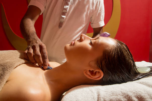 istock Woman in the spa having energizing crystal massage 1172533067