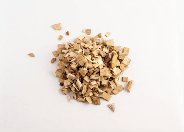 istock smoking wood chips for BBQ on white background 1172535015