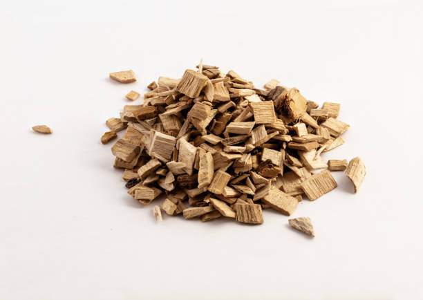 istock smoking wood chips for BBQ on white background 1172535020