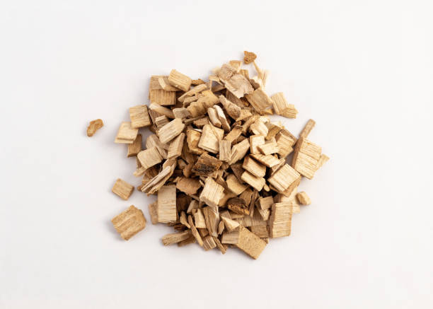 istock smoking wood chips for BBQ on white background 1172535022