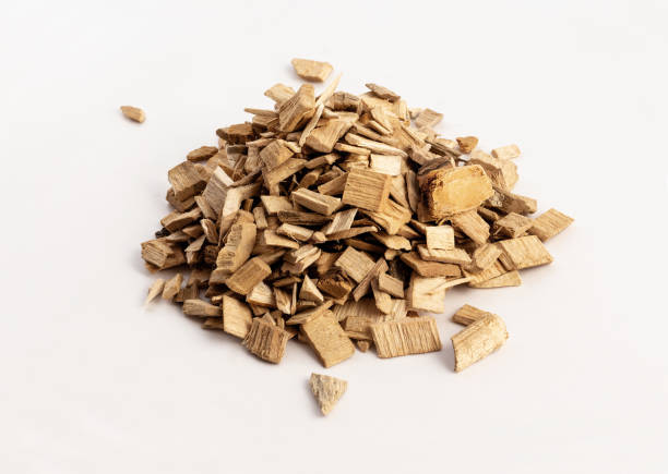 istock smoking wood chips for BBQ on white background 1172535025
