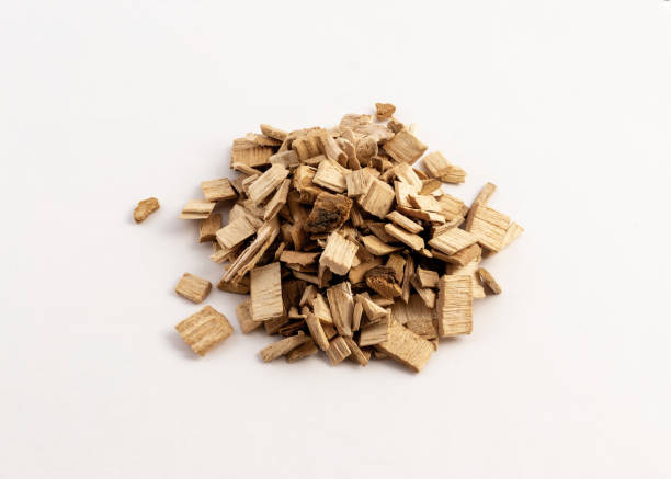istock smoking wood chips for BBQ on white background 1172535027