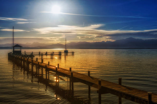 istock Chiemsee at dusk with jetty 1172536640