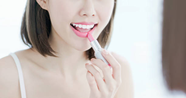 istock Beauty woman use lipstick 1172537146