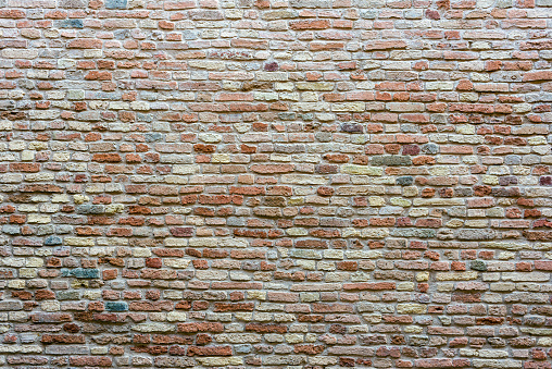 Antique brick stone wall in Italy