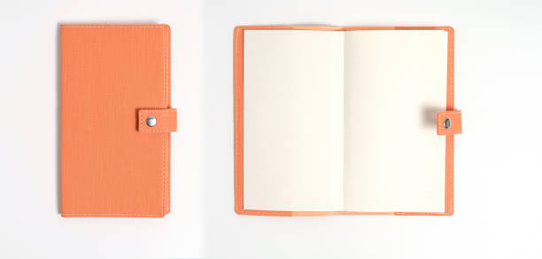 istock top view blank orange leather diary on white desk 1172538122
