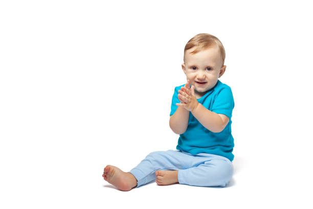 istock Cute baby boy sitting isolated on the white background 1172540078