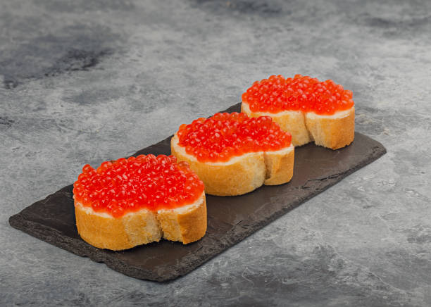 istock sandwich with red caviar on the table 1172540127