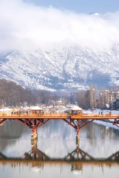 Beautiful scenery of Zero bridge with Himalaya mountain covered with snow in the background.