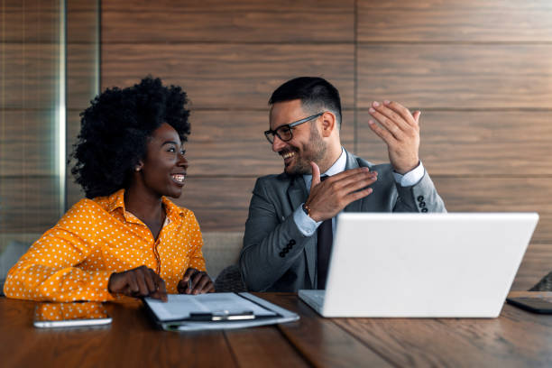 istock Two business people talking in an outdoor office 1172541720