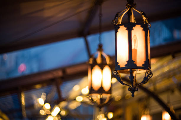 istock Candle lights lanterns on night city. 1172542409