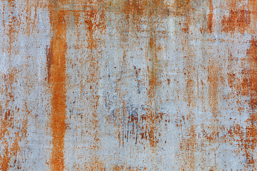 Scratched rusty metal background texture, faded paint peeling, grunge