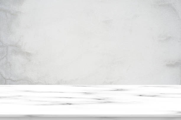 istock close up mockup plain grey cement wall background with luxury white marble effect texture counter perspective for show, ads , promote product on display concept. 1172544413
