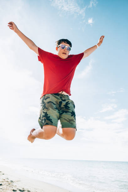 istock Teenage boy at tropical beach 1172547573