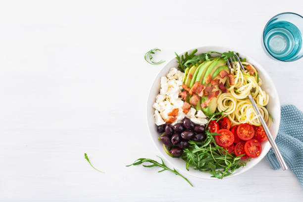 istock ketogenic lunch bowl: spiralized courgette with avocado, tomato, feta cheese, olives, bacon 1172555610