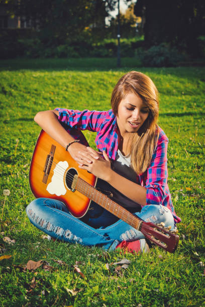 istock Woman with guitar 1172555722