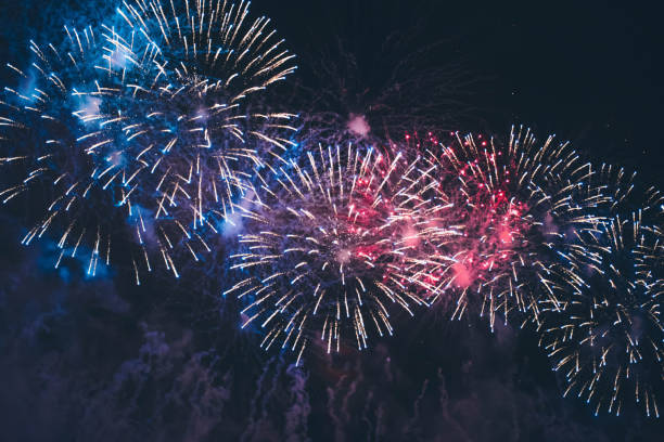 istock Fireworks festival. Fireworks display on dark sky background. 1172555723