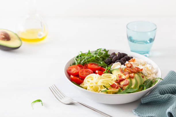 istock ketogenic lunch bowl: spiralized courgette with avocado, tomato, feta cheese, olives, bacon 1172555772