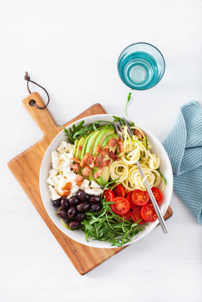 istock ketogenic lunch bowl: spiralized courgette with avocado, tomato, feta cheese, olives, bacon 1172555924