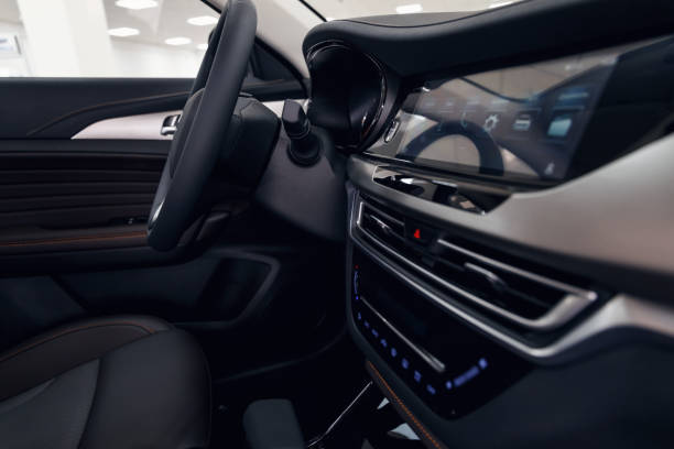 istock Leather car interior. Modern car illuminated dashboard. Luxurious car instrument cluster. Close up shot of automobile instrument panel. Modern car interior dashboard and steering wheel 1172558465