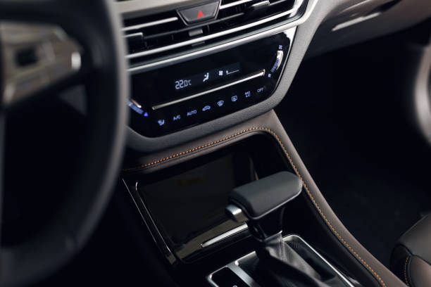 istock Modern car interior. Soft focus. Modern car illuminated dashboard. Luxurious car instrument cluster. Close up shot of automobile instrument panel. Blue interior light 1172558758