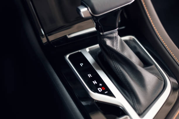 istock Selector automatic transmission with perforated leather in the interior of a modern expensive car. The background is blurred 1172559649
