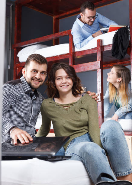 istock Loving couple resting in hostel bedroom 1172560511