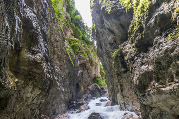 The fascinating Partnach Gorge in Germany The fascinating touristic wildwater Partnach Gorge in Germany partnach gorge stock pictures, royalty-free photos & images